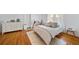 Calm main bedroom with a plush rug, hardwood floors and dresser storage at 830 Barnett Ne St # 2, Atlanta, GA 30306