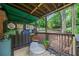 Cozy covered patio area with vintage decor and comfortable seating, creating an outdoor retreat at 830 Barnett Ne St # 2, Atlanta, GA 30306