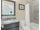 This well-lit bathroom features tile floors, a stylish vanity, and shower-tub combination with modern tiling at 328 Brownstones Cir, Atlanta, GA 30312