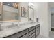 Elegant bathroom with double sinks, marble countertops, and framed mirrors providing a luxurious feel at 328 Brownstones Cir, Atlanta, GA 30312