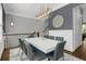 Dining room with modern chandelier, grey chairs, and stairway at 328 Brownstones Cir, Atlanta, GA 30312