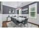 Elegant dining room with modern light fixture, white table, and stylish decor at 328 Brownstones Cir, Atlanta, GA 30312