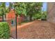 Community dog park with fencing, mulch ground cover, and green shrubs and trees at 328 Brownstones Cir, Atlanta, GA 30312