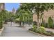 Gated community entrance with meticulous landscaping, brick facade, and mature trees at 328 Brownstones Cir, Atlanta, GA 30312