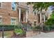 Brick townhome exterior, lovely front yard, nice landscaping, and inviting entrance at 328 Brownstones Cir, Atlanta, GA 30312