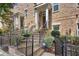 Charming brick townhome with wrought iron railings and landscaped front yard at 328 Brownstones Cir, Atlanta, GA 30312