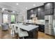 Spacious kitchen with marble countertops, stainless steel appliances, and a breakfast bar at 328 Brownstones Cir, Atlanta, GA 30312