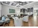 Open-concept living area featuring modern furnishings, coffered ceiling, and seamless flow to the kitchen at 328 Brownstones Cir, Atlanta, GA 30312