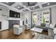 Cozy living room features a fireplace, built-in cabinets, and hardwood floors at 328 Brownstones Cir, Atlanta, GA 30312