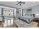 Tranquil main bedroom featuring a bay window, chandelier, and hardwood floors at 328 Brownstones Cir, Atlanta, GA 30312
