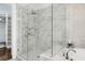 Spa-like shower with glass enclosure, multiple shower heads, and marble accents for a serene experience at 328 Brownstones Cir, Atlanta, GA 30312