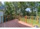 Spacious back deck overlooking a lush green backyard with mature trees at 4105 Vicksburg Dr, Lawrenceville, GA 30044