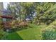 Well-manicured backyard featuring a lush lawn and a charming wooden deck, perfect for outdoor relaxation at 4105 Vicksburg Dr, Lawrenceville, GA 30044