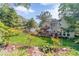 Beautiful backyard with a lush lawn, a wooden deck, and landscaping, creating a perfect outdoor retreat at 4105 Vicksburg Dr, Lawrenceville, GA 30044