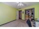 Bright bedroom featuring a desk, chair, and windows with an open closet at 4105 Vicksburg Dr, Lawrenceville, GA 30044