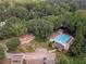 An aerial view shows a pristine community pool amidst lush greenery, offering a refreshing escape at 4105 Vicksburg Dr, Lawrenceville, GA 30044