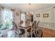 Spacious dining room with a table and hardwood floors at 4105 Vicksburg Dr, Lawrenceville, GA 30044