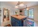 Bright kitchen with a central island, view to the backyard and breakfast area at 4105 Vicksburg Dr, Lawrenceville, GA 30044