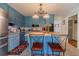 Bright kitchen featuring a center island, blue cabinets, granite countertops and stainless appliances at 4105 Vicksburg Dr, Lawrenceville, GA 30044