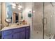 Stylish main bathroom with double vanity, granite countertops, and glass shower at 4105 Vicksburg Dr, Lawrenceville, GA 30044