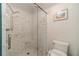 Modern glass enclosed shower with white tile and built in seat at 4105 Vicksburg Dr, Lawrenceville, GA 30044