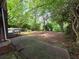 A sprawling backyard with mature trees and a cozy deck at 510 Se Boyds Se Dr, Marietta, GA 30067