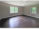Serene bedroom with hardwood floors and windows offering views of lush greenery at 510 Se Boyds Se Dr, Marietta, GA 30067