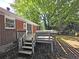 Back exterior view features a wooden deck with stairs and brick siding at 510 Se Boyds Se Dr, Marietta, GA 30067