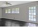 Living room with hardwood floors and a bright door and windows offering natural light at 510 Se Boyds Se Dr, Marietta, GA 30067