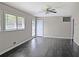 A bright living room with hardwood floors, a ceiling fan, and multiple windows offering natural light at 510 Se Boyds Se Dr, Marietta, GA 30067