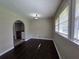 Living room featuring hardwood floors and an arched doorway leading to a laundry room at 510 Se Boyds Se Dr, Marietta, GA 30067