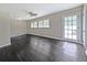 Bright living room featuring hardwood floors, ceiling fan, and natural light from multiple windows at 510 Se Boyds Se Dr, Marietta, GA 30067