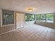 Bright sunroom featuring tile floors and natural light streaming through multiple windows at 510 Se Boyds Se Dr, Marietta, GA 30067