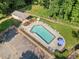 Aerial view of an inground pool, open-air shelter, and treelined backyard at 5340 Harris Creek Dr, Cumming, GA 30040
