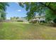 Spacious backyard featuring a large lawn, fenced perimeter and treelined border at 5340 Harris Creek Dr, Cumming, GA 30040