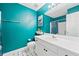 Bathroom with teal walls and modern fixtures offering a comfortable space at 5340 Harris Creek Dr, Cumming, GA 30040
