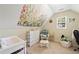 Comfortable bedroom with sloped ceilings, neutral walls, and natural light at 5340 Harris Creek Dr, Cumming, GA 30040