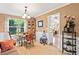 Cozy dining area features a round table, china cabinet, and natural light at 5340 Harris Creek Dr, Cumming, GA 30040