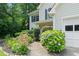Charming two-story home with well-manicured landscaping and a walkway at 5340 Harris Creek Dr, Cumming, GA 30040