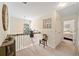Upstairs hallway featuring neutral walls, carpet, and natural light from a arched window at 5340 Harris Creek Dr, Cumming, GA 30040