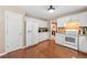 Spacious kitchen features white appliances, plenty of counter space, and hardwood floors, for a seamless cooking experience at 5340 Harris Creek Dr, Cumming, GA 30040