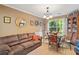 Inviting living room with comfortable seating and natural light from large windows at 5340 Harris Creek Dr, Cumming, GA 30040