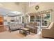 Inviting living room with large windows and open access to kitchen area at 5340 Harris Creek Dr, Cumming, GA 30040