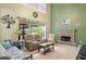 Relaxing living room with a stone fireplace, large windows, and comfortable seating at 5340 Harris Creek Dr, Cumming, GA 30040