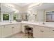 Bright bathroom featuring dual sinks, vanity area and plenty of counter space at 5340 Harris Creek Dr, Cumming, GA 30040