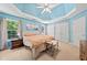 Spacious main bedroom with tray ceiling, large windows, and ample closet space at 5340 Harris Creek Dr, Cumming, GA 30040