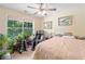 Bedroom featuring a seating area with a massage chair and large windows at 5340 Harris Creek Dr, Cumming, GA 30040