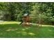 Backyard playground with swings and a slide for outdoor fun at 5340 Harris Creek Dr, Cumming, GA 30040