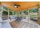 Inviting sunroom with natural wood accents, outdoor views, and comfortable seating at 5340 Harris Creek Dr, Cumming, GA 30040