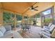 Relaxing sunroom with many windows, wood ceiling, and outdoor views at 5340 Harris Creek Dr, Cumming, GA 30040